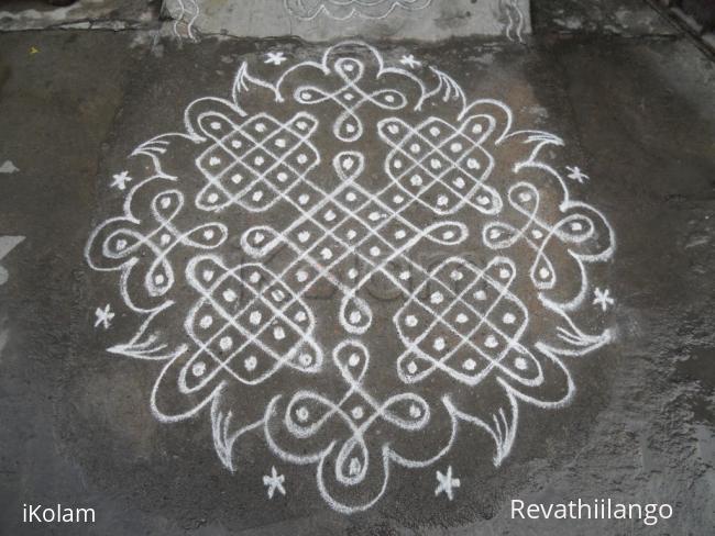 Rangoli: Chikku kolam in white.