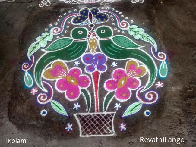 Rangoli: Rev's magazhi creation 8. Double parrot.