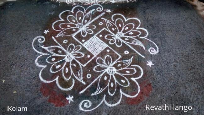 Rangoli: Rev's daily kolam,white swastik designed.