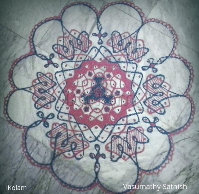 Rangoli: Chikku kolam with 15-8 interlaced dots.