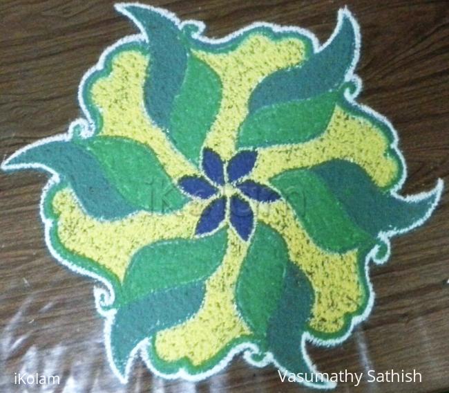 Rangoli: A dotted rangoli with 9-5 interlaced dots