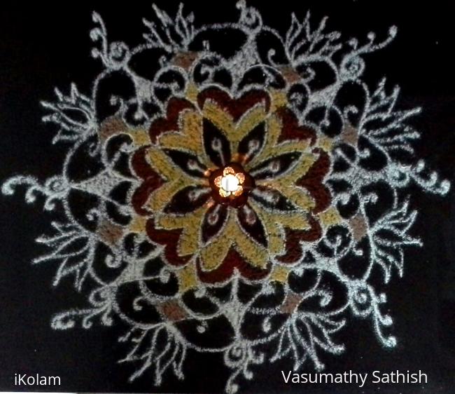 Rangoli: Pooja kolam with rice flour coloured with haldi and kumkum