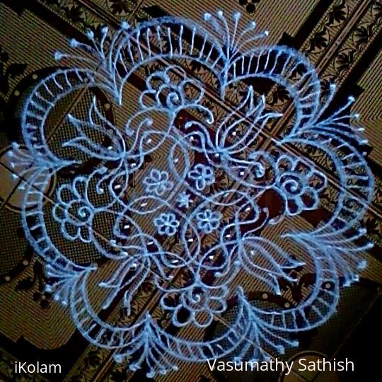 Rangoli: Chikku kolam with 7-1 straight dots.