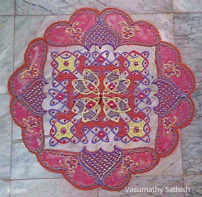 Rangoli: Multi coloured chikku mat with 10-10 straight dots. 