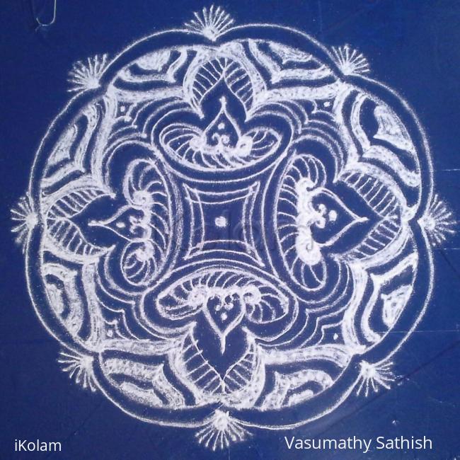 Rangoli: A  padi kolam with kolamavu.