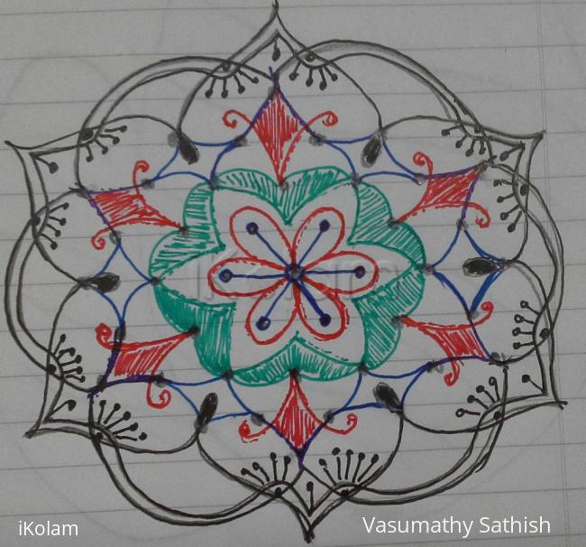 Rangoli: Dotted rangoli with 7-4 interlaced dots. 