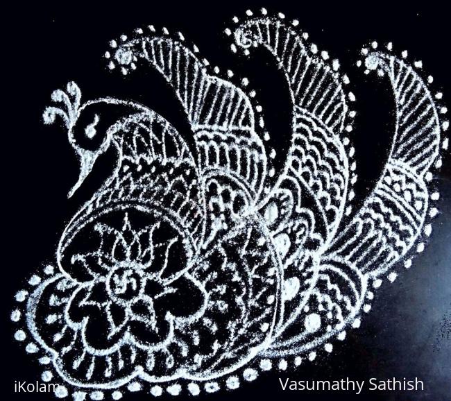 Rangoli: Freehand peacock rangoli with lotus and small swastik 