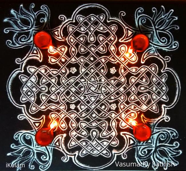 Rangoli: Day 2  Margazhi Kolam - A chikku  kolam  with 9-9 straight dots ; 5×2;3×1 on all sides in the centre 