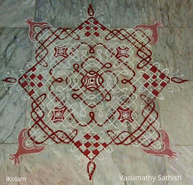 Rangoli: Margazhi Day 24 kolam - A chikku padi kolam with rice flour n red colour.  15-15 straight dots n 5,3,1 on all side in the centre 