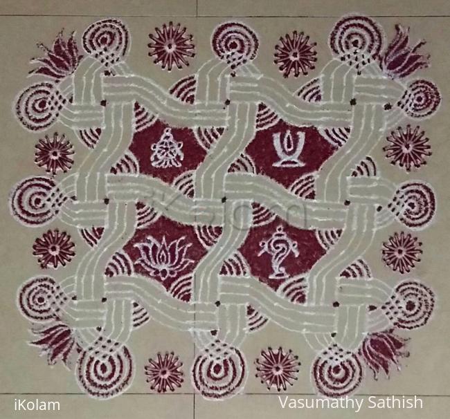 Rangoli: Swastik Padi kolam with Chakra, Shangu, Thirumann and Lotus for Narasimha Jay anti. 