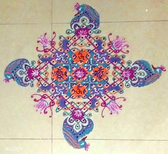 Rangoli: Chikku Kolam with 19-1 straight dots with freehand peacock extension