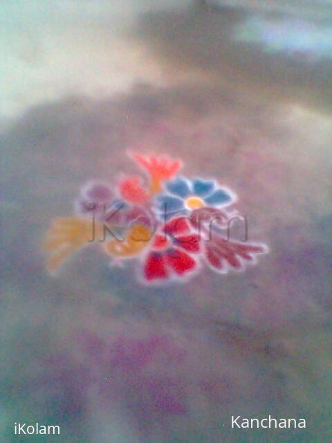 Rangoli: three cute birds on three bright flowers